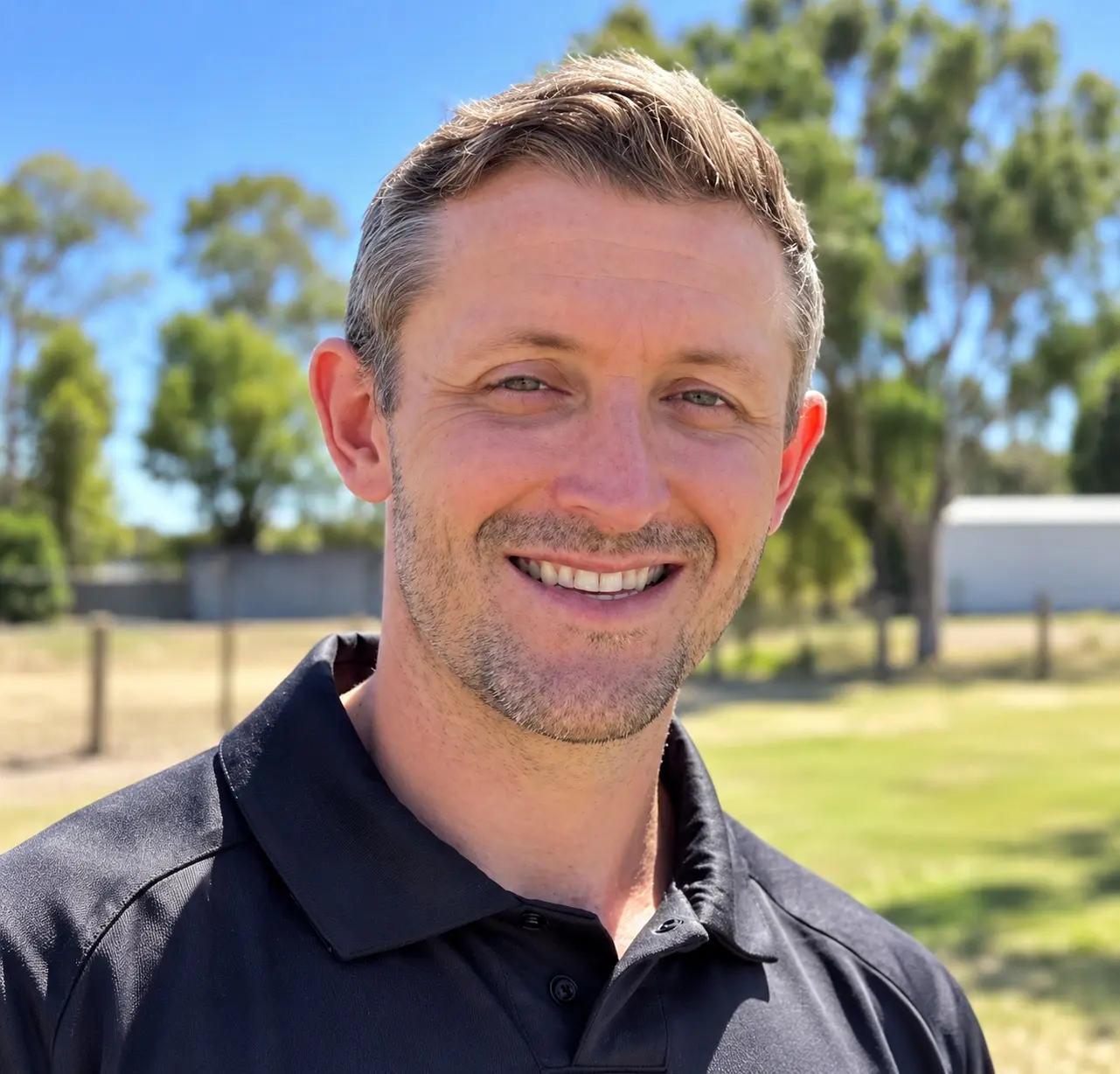 Christopher Bennett smiling outdoors